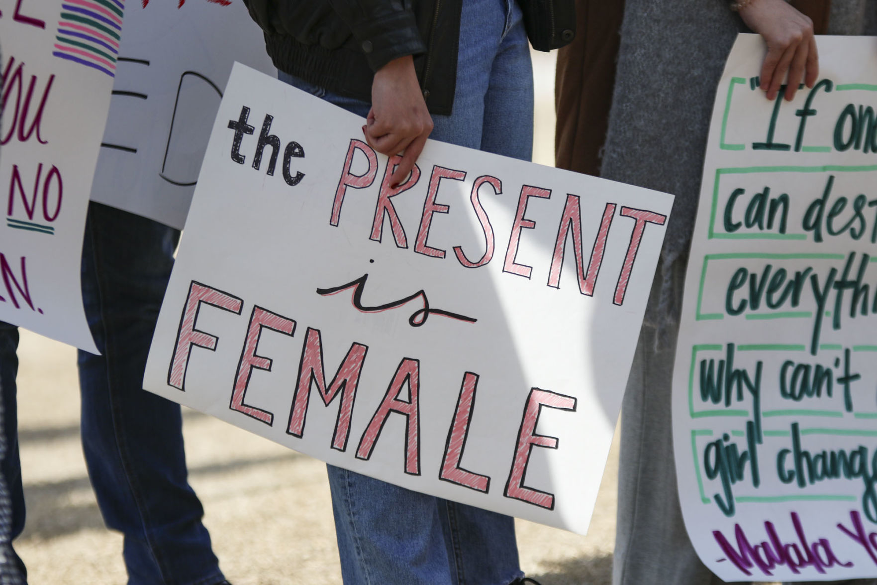 “The present is female” sign